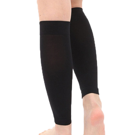 Pair of black calf support sleeves shown worn on the legs