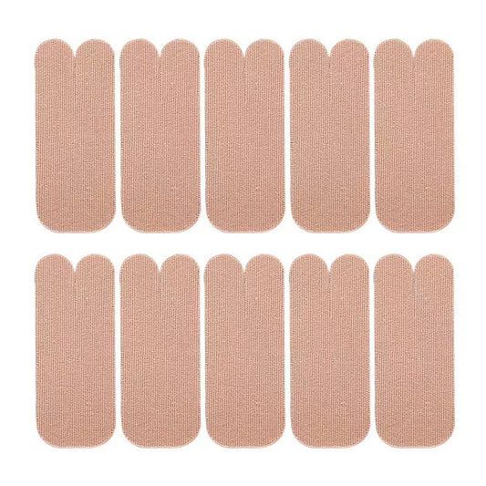 Thumb wearing beige self-adhesive support patch on white background
