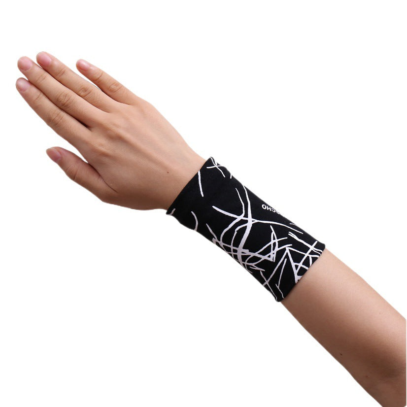 Black patterned wrist support sleeve worn on the wrist and lower forearm