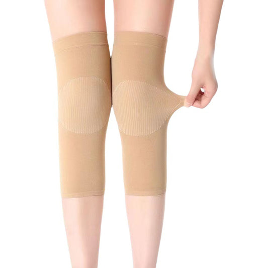 Skin tone seamless knee support sleeves worn on legs against a white background