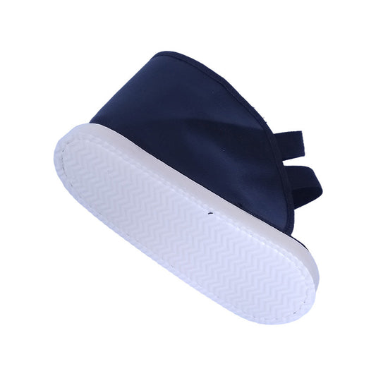 Black open-toe foot recovery shoe cover with thick white sole and rear strap