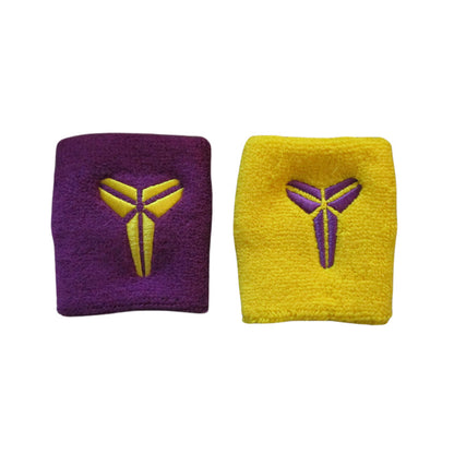 Cotton wrist sweatbands in purple and yellow with sporty embroidered design on a white background
