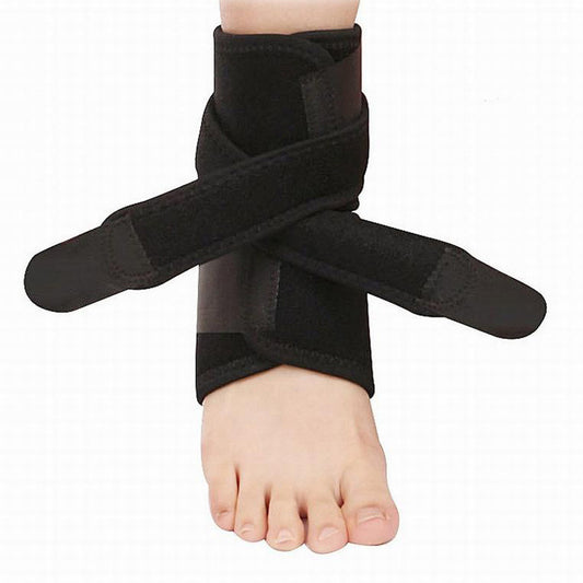 Black compression ankle brace with adjustable wraparound strap worn on foot