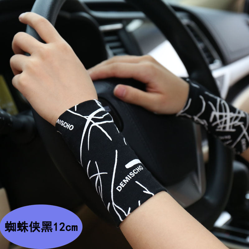 Striped black and white wrist support sleeve showing pattern and length