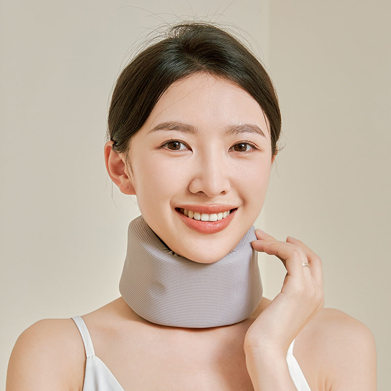 Dark gray neck support brace on model showing side profile and back closure detail