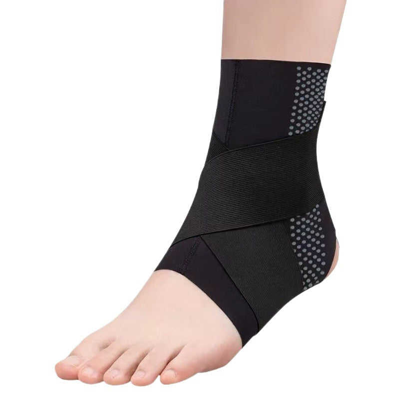 Black ankle support brace with side pads worn on foot and ankle