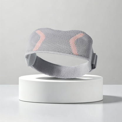 Gray patella knee support strap worn on knee