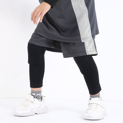 Blue kids padded knee support sleeve worn during sports activity