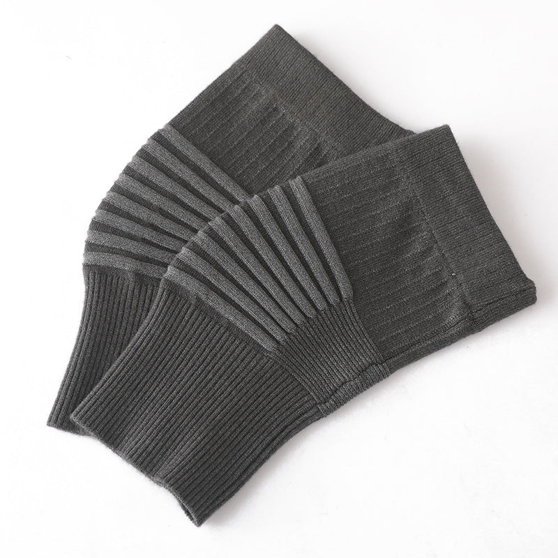 Dark gray knit knee support sleeve pair showing ribbed elastic texture