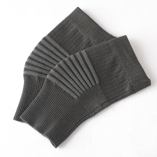Dark gray knit knee support sleeve pair showing ribbed elastic texture