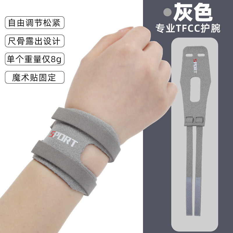 Black thumb wrist brace worn on the hand and wrist showing adjustable support fit