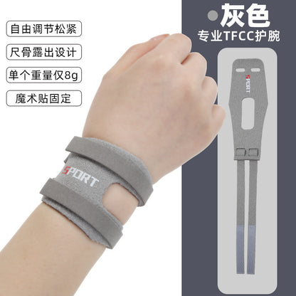 Black thumb wrist brace worn on the hand and wrist showing adjustable support fit