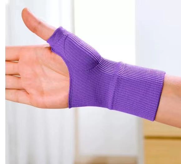 Black thumb brace sleeve on hand highlighting open thumb shape and knit construction