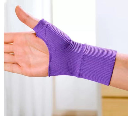 Black thumb brace sleeve on hand highlighting open thumb shape and knit construction