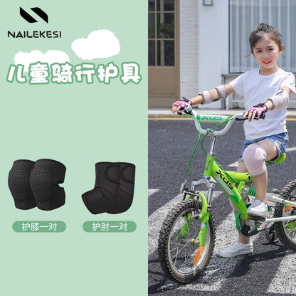 Black kids elbow pads shown worn during active movement