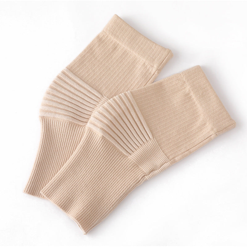 Dark gray knee support sleeves worn on legs to show fit and coverage