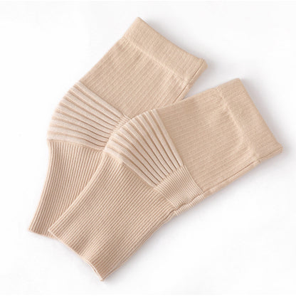Dark gray knee support sleeves worn on legs to show fit and coverage