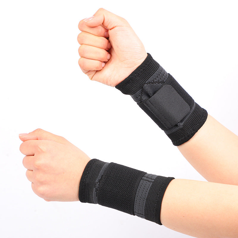 Black wrist brace with thumb loop and wrap design shown on both wrists