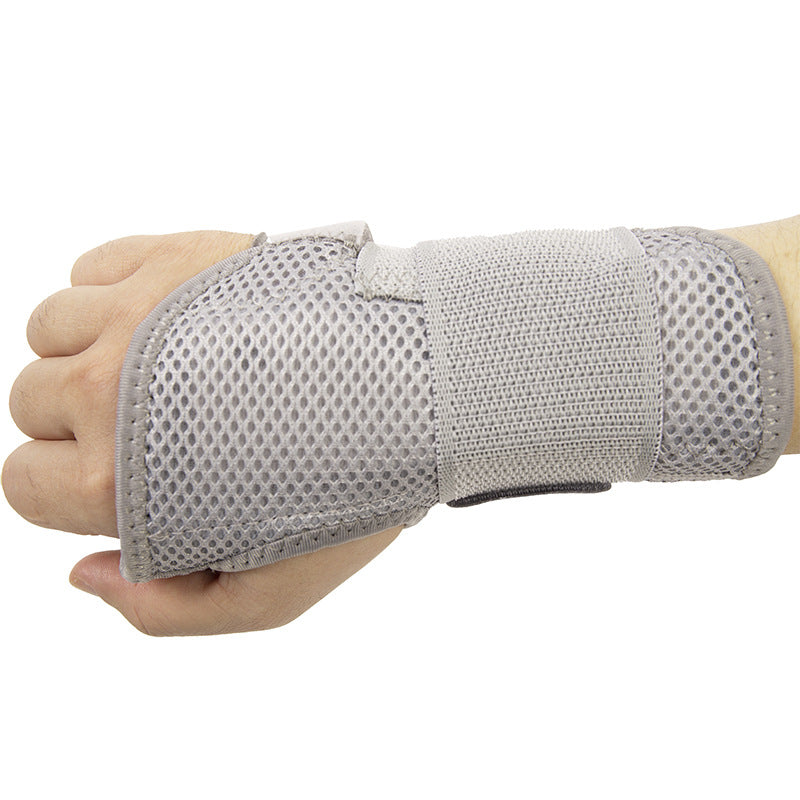 Front view of gray thumb wrist brace with thumb opening and wrap-around support design