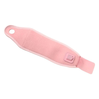 Pink heated wrist and thumb support brace flat lay view