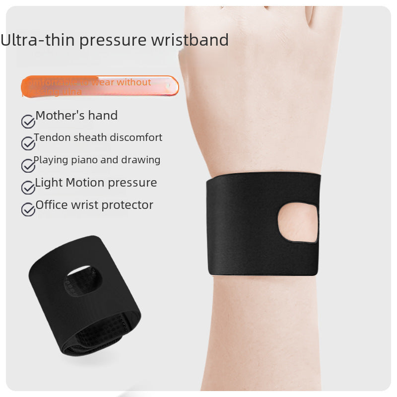 Black wrist support brace worn on wrist showing slim flexible fit
