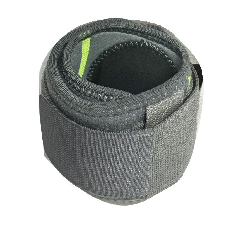 Dark gray adjustable elbow support brace with wraparound compression strap on white background