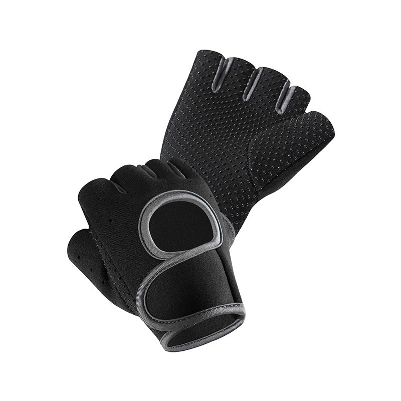 Gray fingerless workout gloves with padded palm and wrist strap on a white background