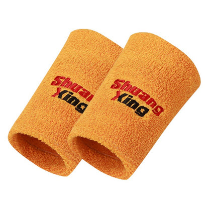 Orange cotton terry wrist sweatband on a white background