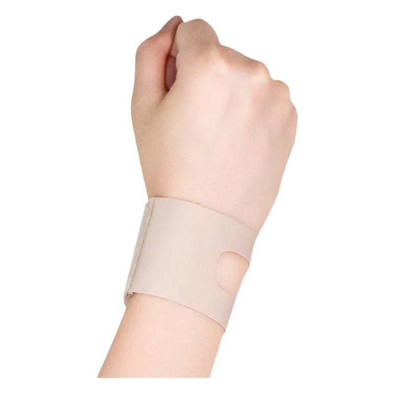 Nude adjustable thumb wrist brace sleeve worn on wrist with low-profile supportive fit