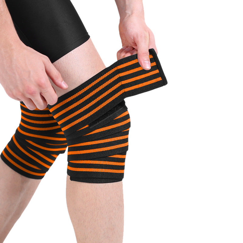 Close-up of striped knee support wrap being adjusted on the leg to show fit and texture