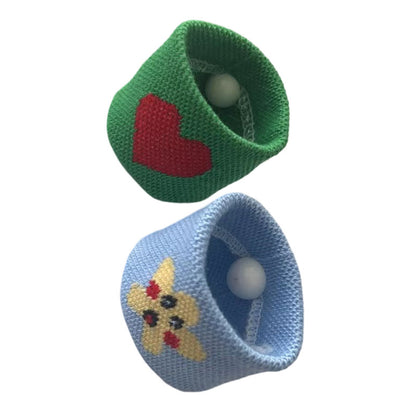 Green knit thumb wrist support band with circular support insert on white background