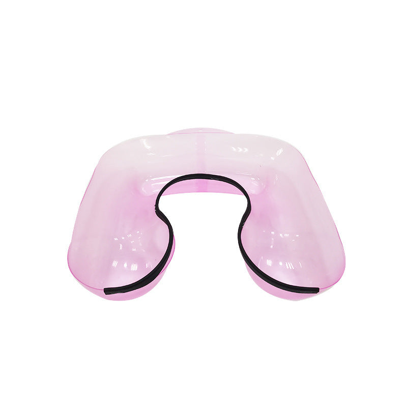 Pink U-shaped salon neck support tray on white background