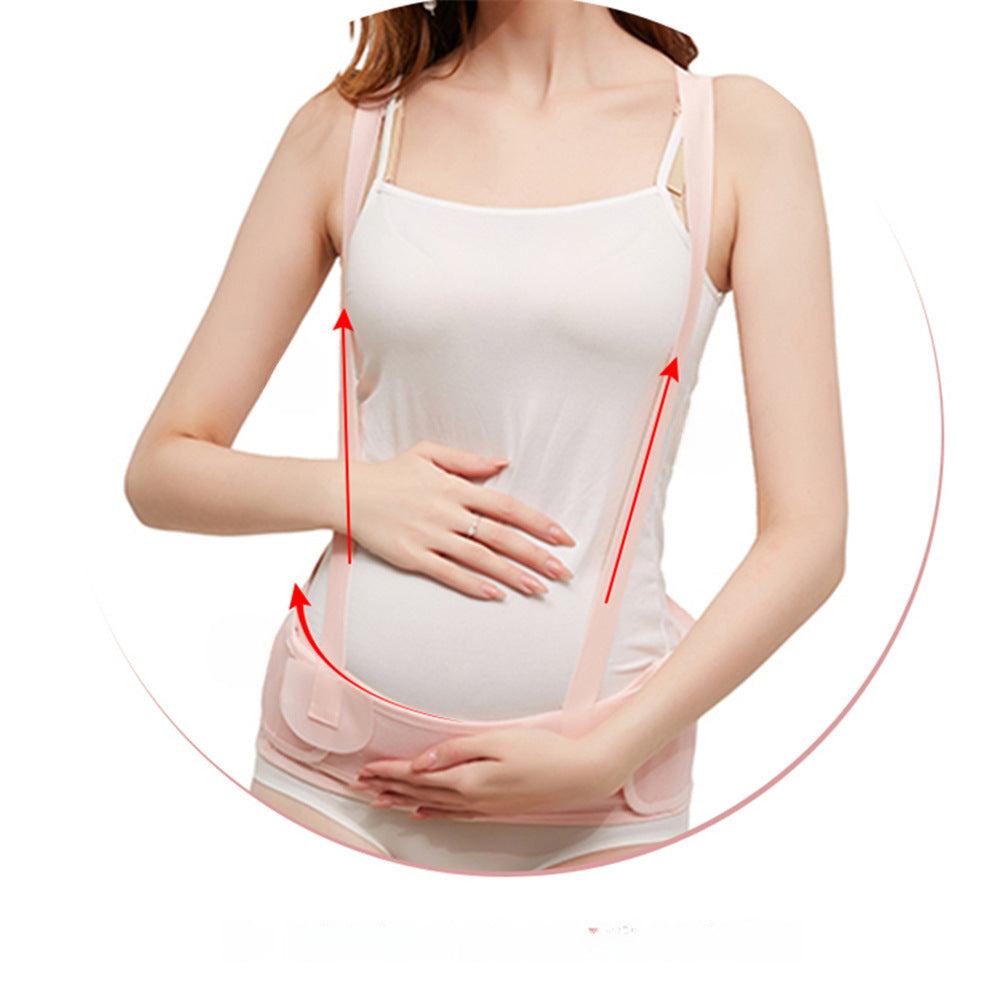 Pregnant woman wearing a pink maternity belly support belt with shoulder straps