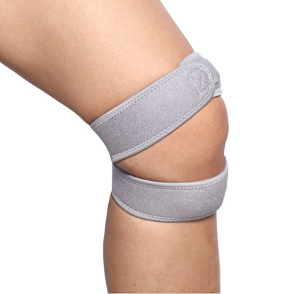 Black and orange patella knee support strap flat lay view