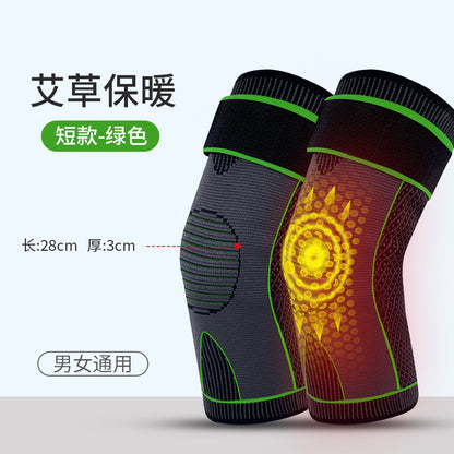 Person wearing an orange knee support sleeve with adjustable strap