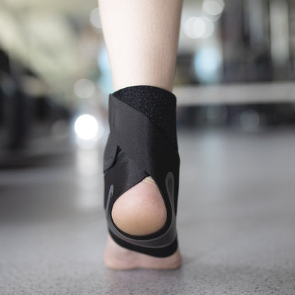 Adjustable ankle support brace worn during sports activity