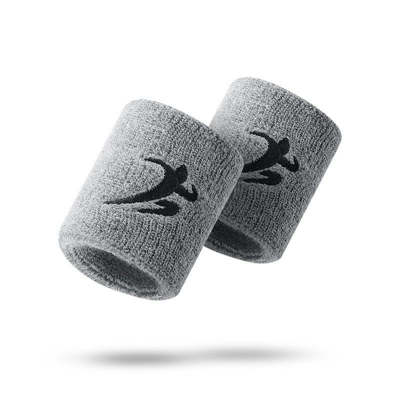 Pair of grey breathable elastic wrist support sleeves on white background