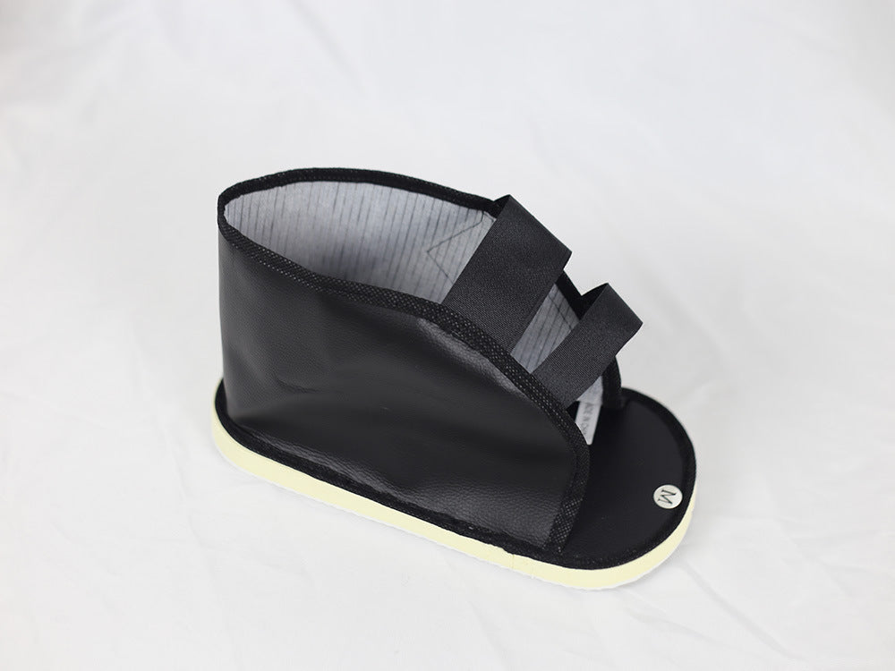 Top view of black recovery shoe cover showing open-toe design and interior footbed