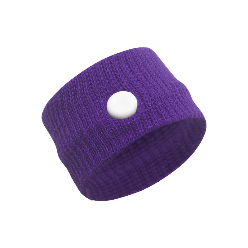 Close view of green slip-on thumb wrist support band in stretch knit fabric