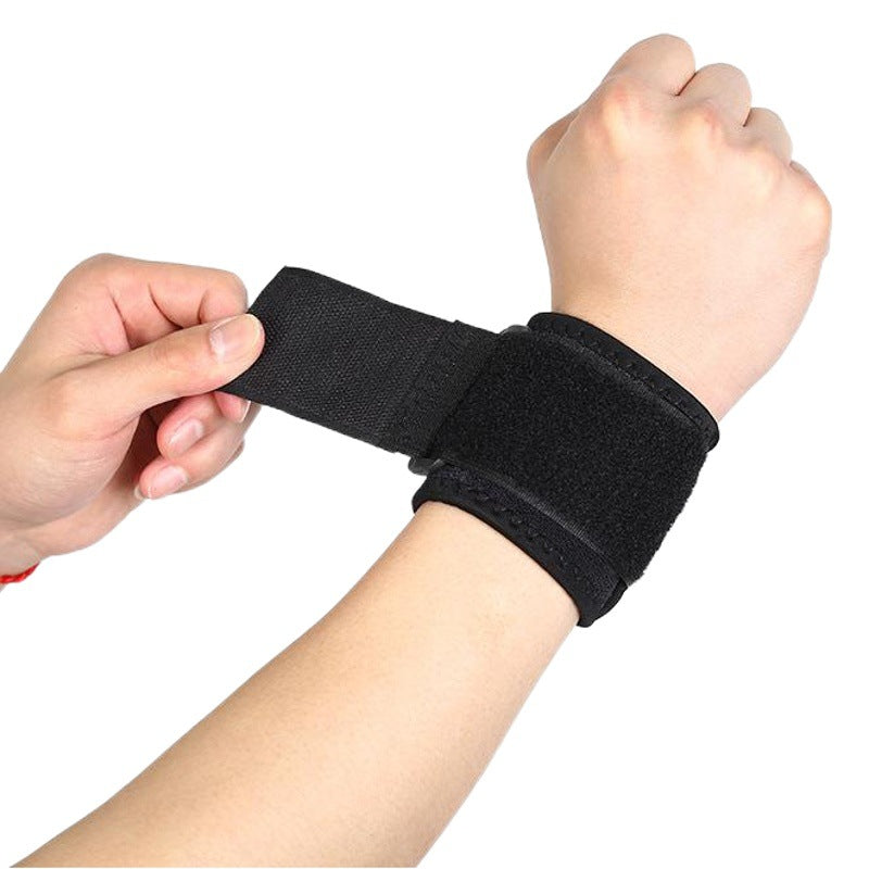 Close-up of hook and loop fastening area on black thumb wrist brace