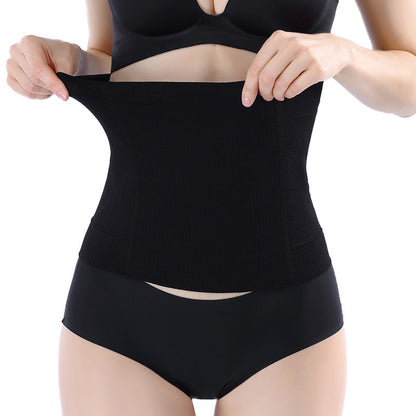 Nude seamless maternity belly support belt worn on body showing smooth coverage under clothing