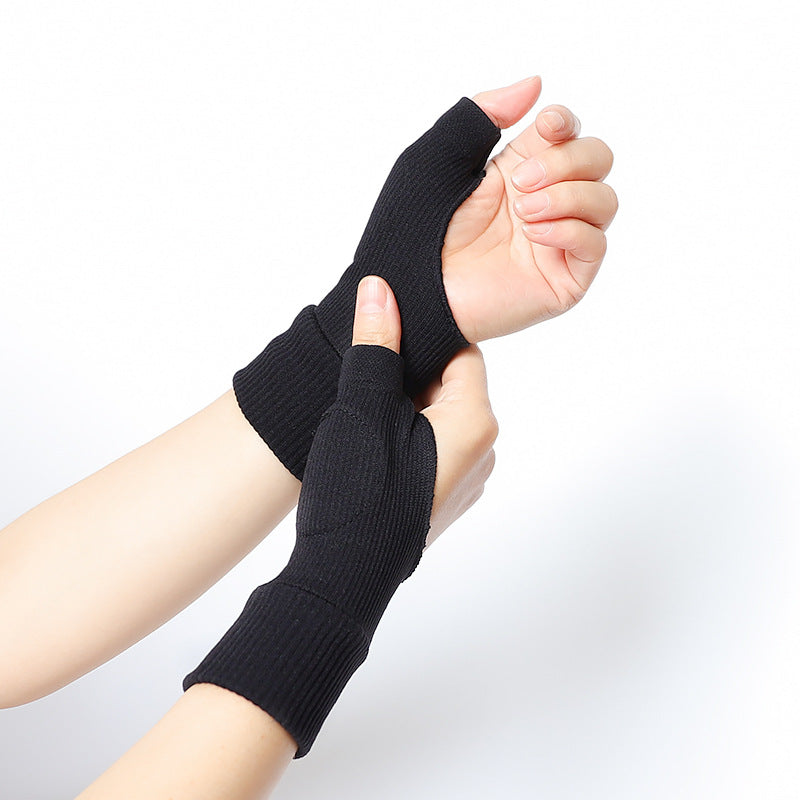 Black thumb support wrist brace displayed on hand against white background