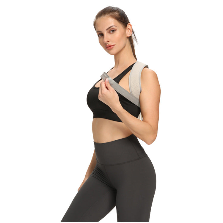 Gray posture corrector brace flat lay showing padded back panel and buckle closure