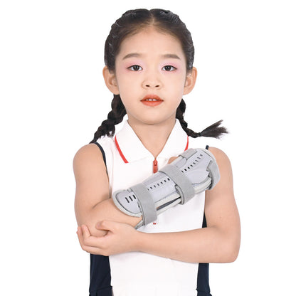 Child wearing a black pediatric wrist and forearm support brace