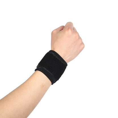 Black adjustable thumb wrist brace worn on hand with wrap-around support