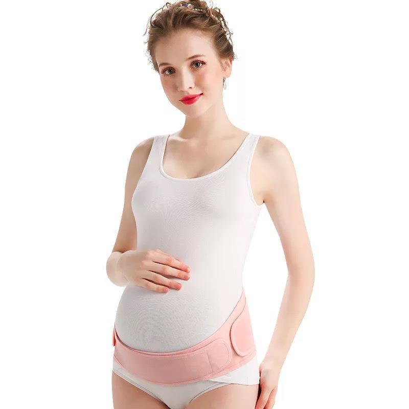 Front view of skin tone maternity belly support belt on model