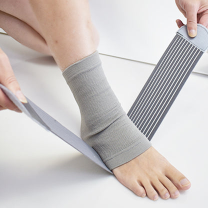 Black compression ankle brace showing knitted texture and wrap shape