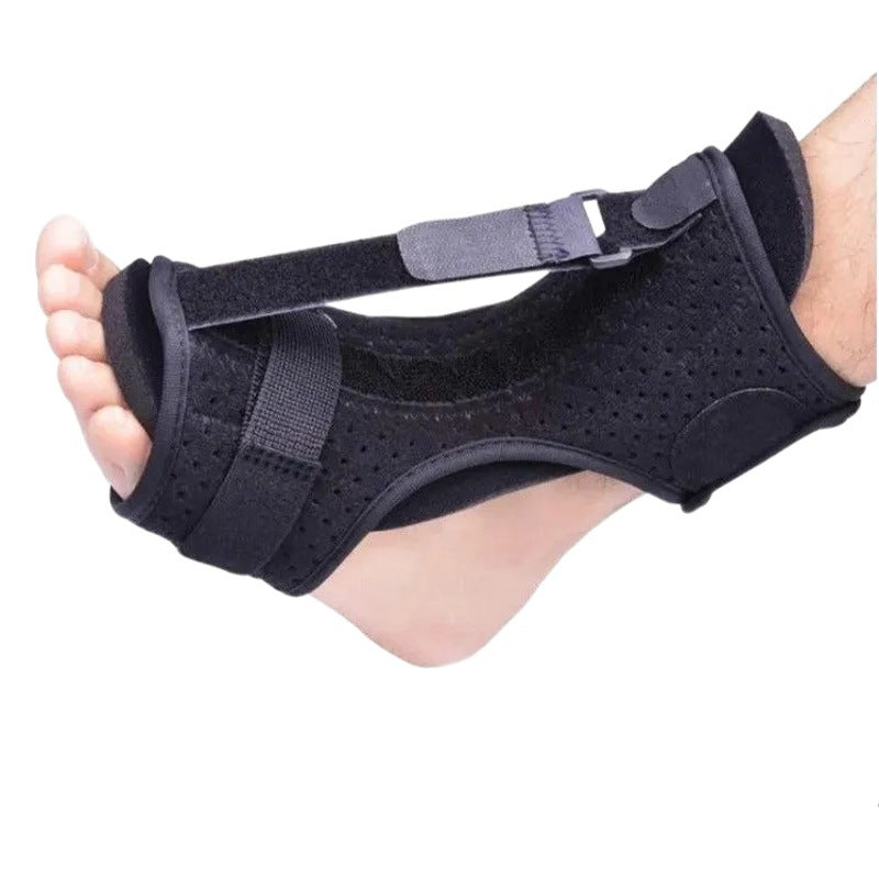 Black ankle and foot support brace shown in lifestyle setting with adjustable wrap design