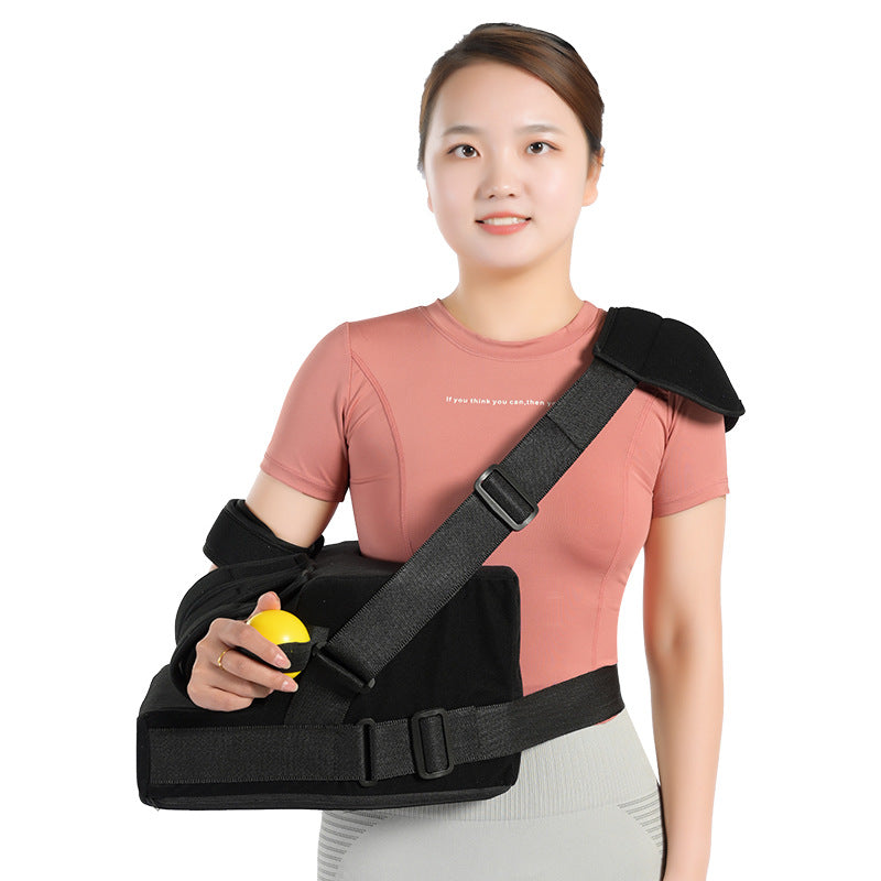 Shoulder abduction support brace worn on upper body with visible shoulder and waist straps