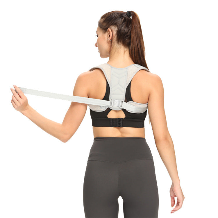 Back view of fitted upper back support brace on adult model